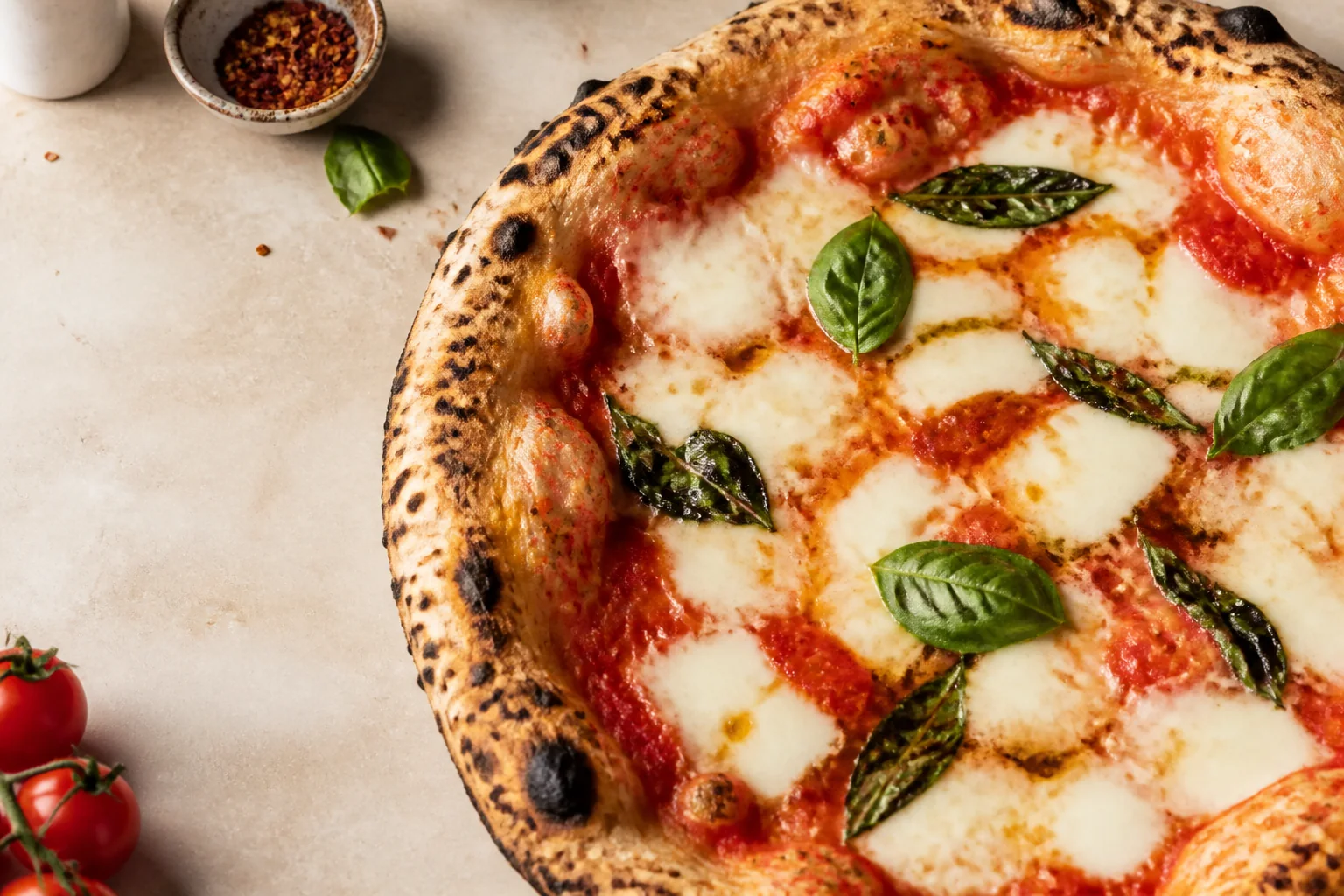 Wood-fired pizza representing Ember